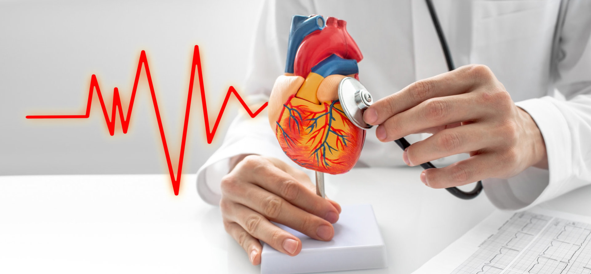 doctor using a stethoscope on a heart figure
